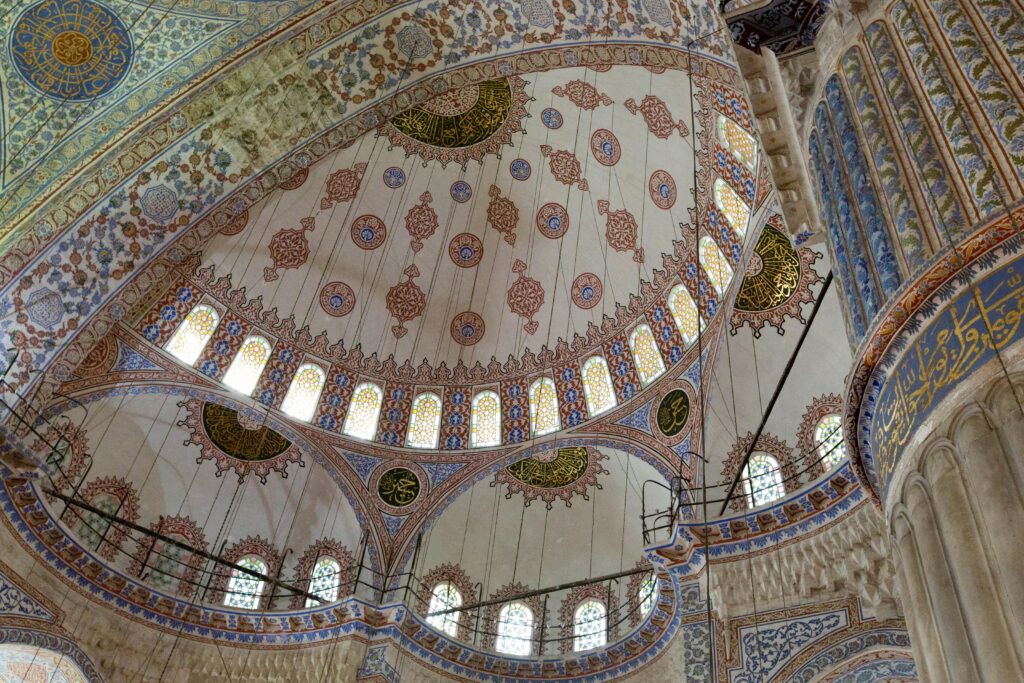 Captivating view of the intricate dome design inside the Blue Mosque in Istanbul, Turkey.