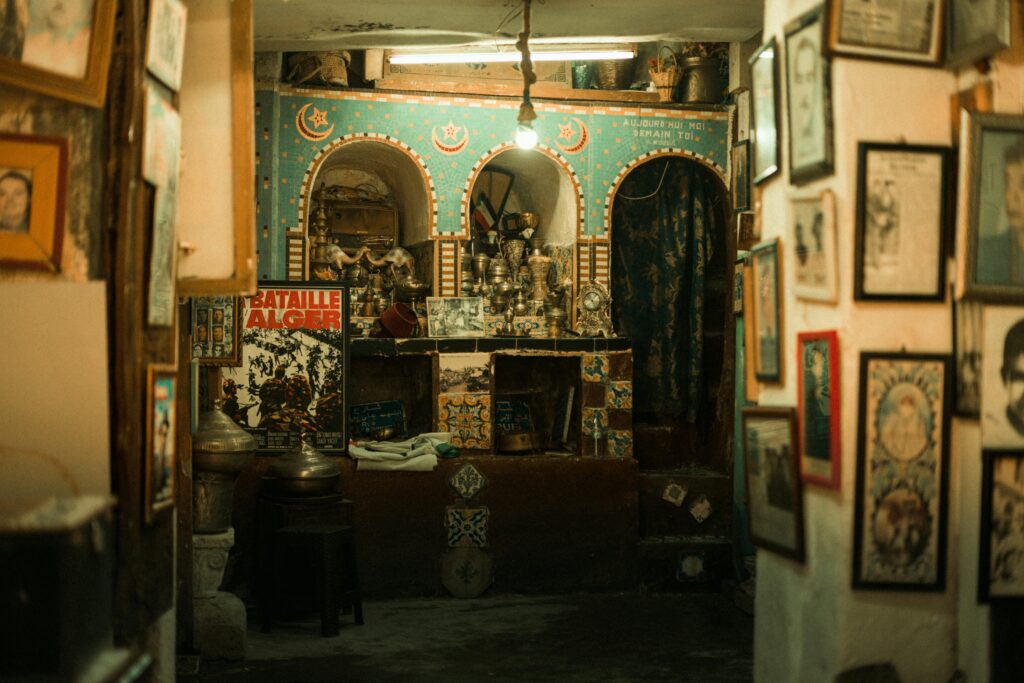 Cozy vintage interior with ornate archways and eclectic art decorations, creating a nostalgic atmosphere.