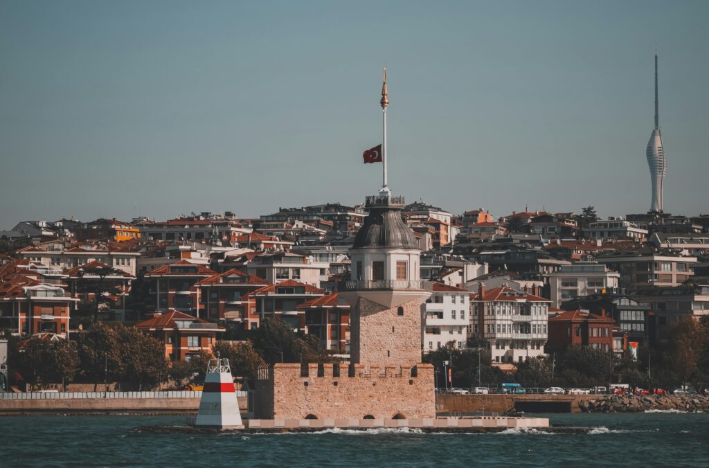 pexels-photo-18824060-18824060 Captivating view of Maiden's Tower in Istanbul with cityscape backdrop and gentle blue sky.